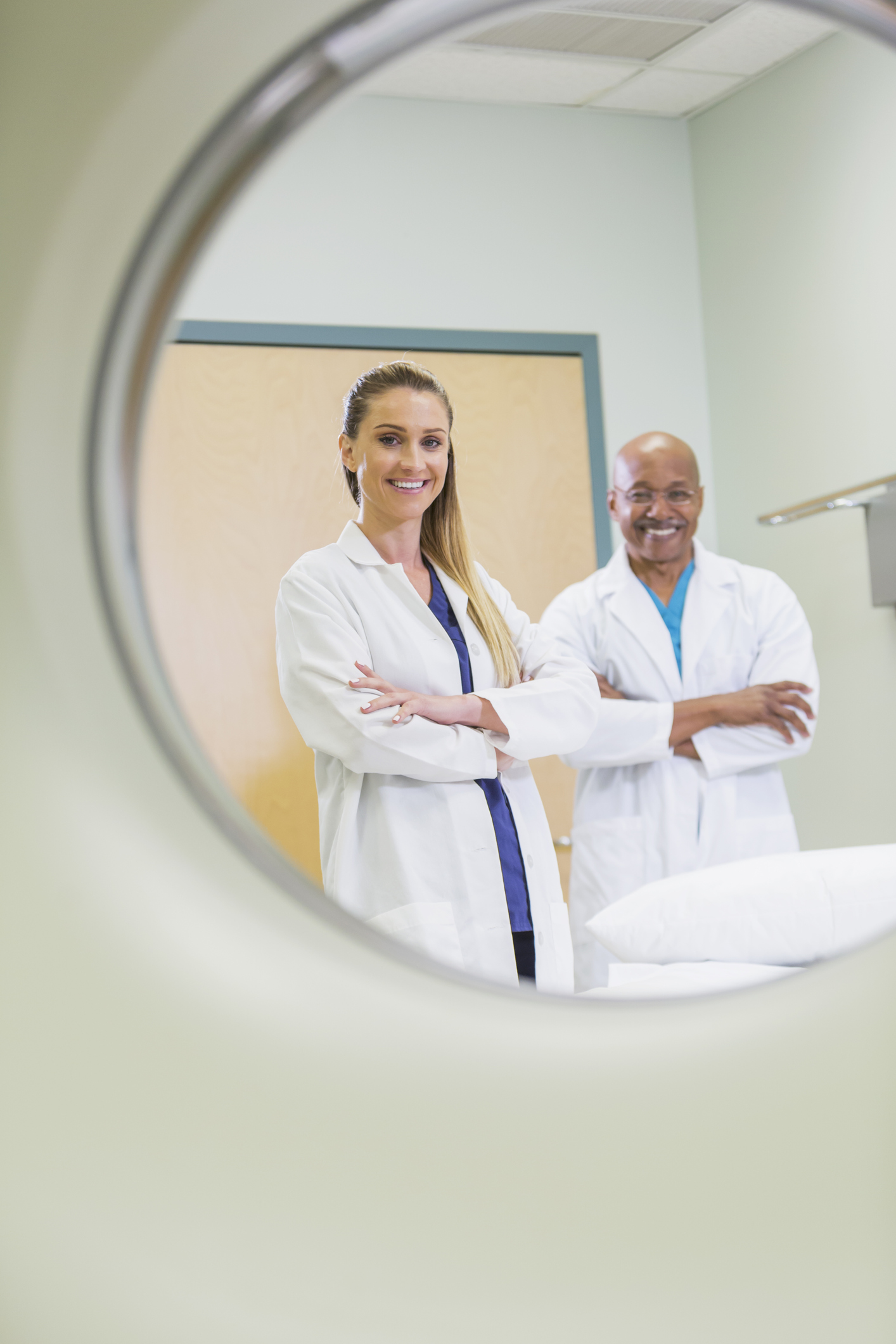 View of doctors through CT scanner